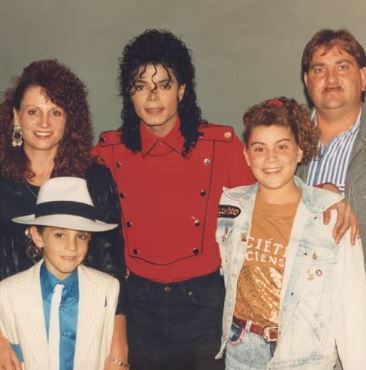 Joy Robson with her husband, children and Michael Jackson